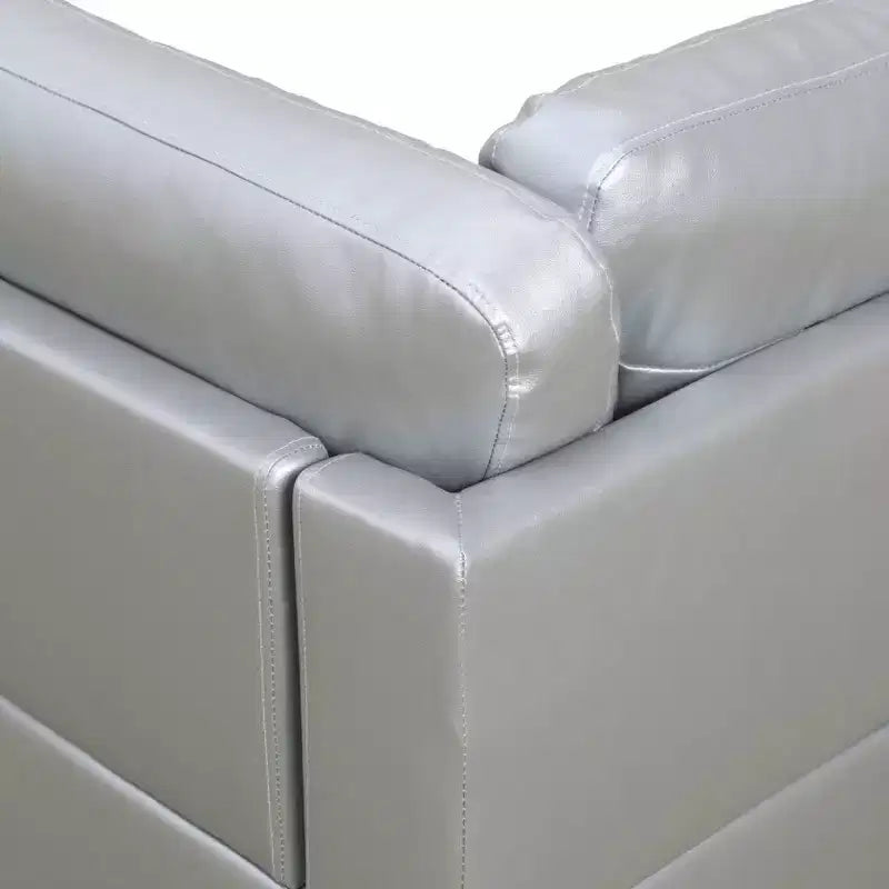 Canapé sectionnel en semi-cuir gris clair - Design moderne en L, coussins capitonnés, oreillers décoratifs, pouf de rangement